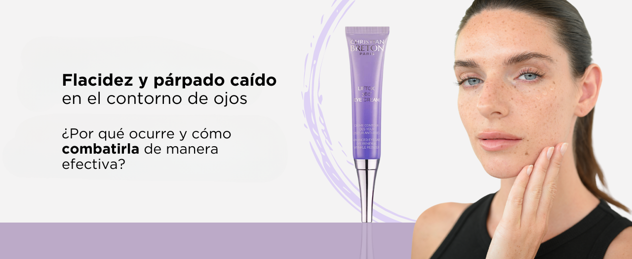 Una mujer se está aplicando una crema morada en la cara.