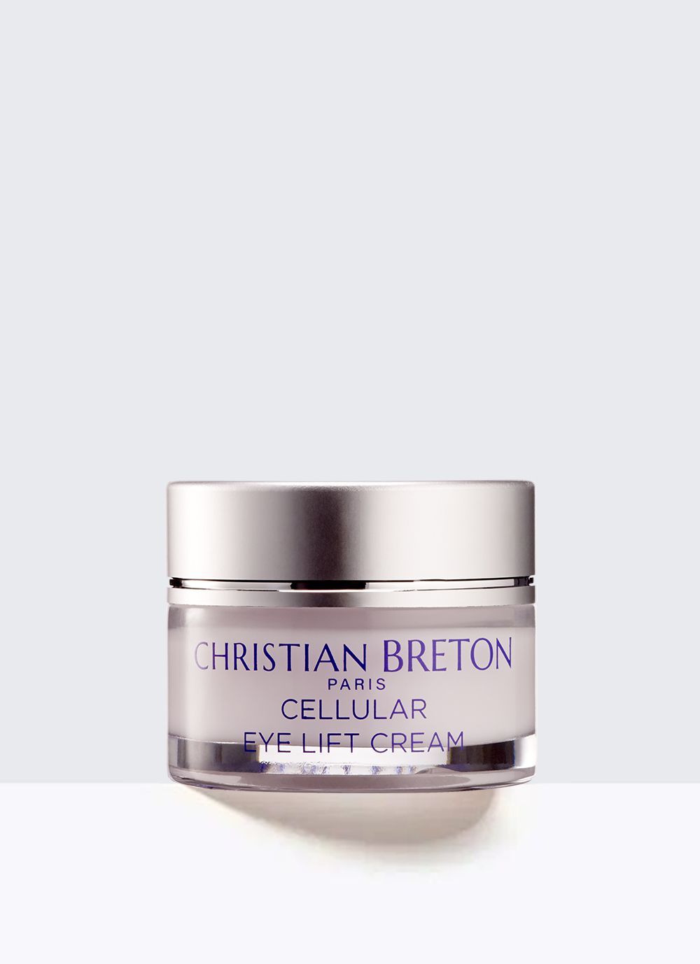 Un frasco de crema para levantar los ojos Christian Breton sobre un fondo blanco.