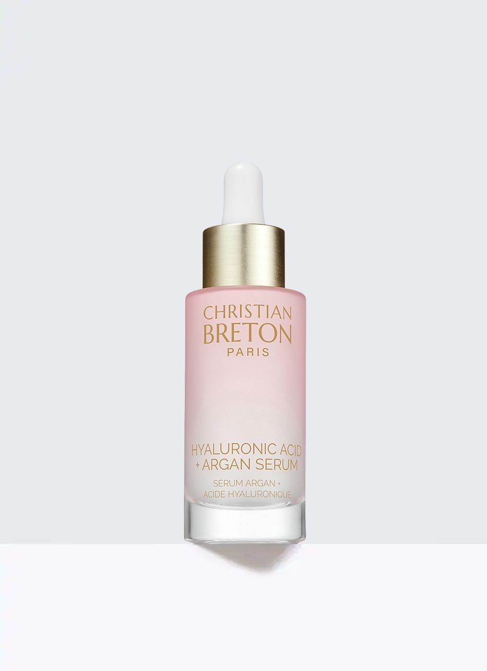 Un tubo morado de crema para ojos christian breton sobre un fondo blanco.