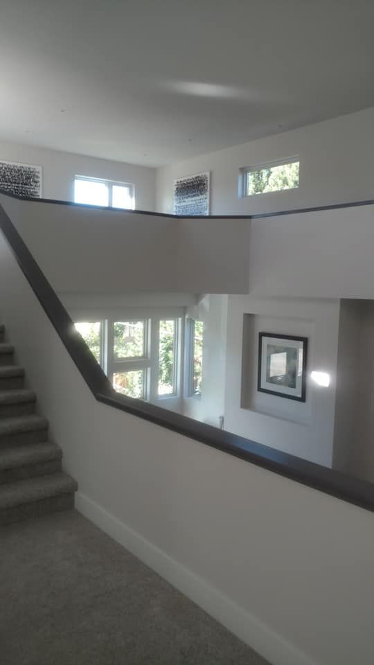 A Staircase With High Ceiling Design | Littleton, CO | All Phase Construction Company LLC