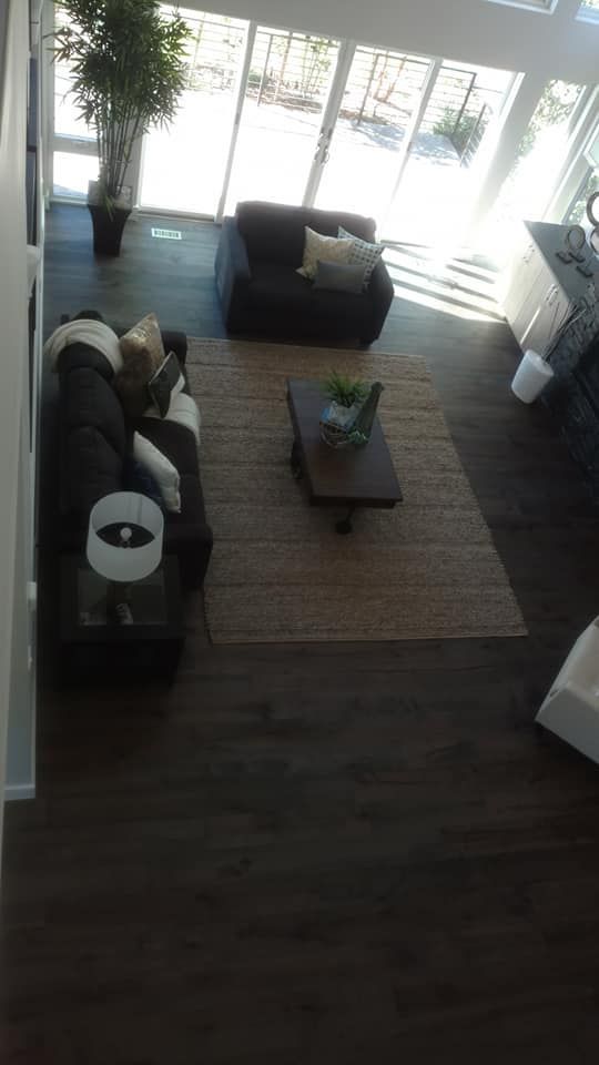 An Aerial View Of A Living Room With Two Couches And A Coffee Table | Littleton, CO | All Phase Construction Company LLC