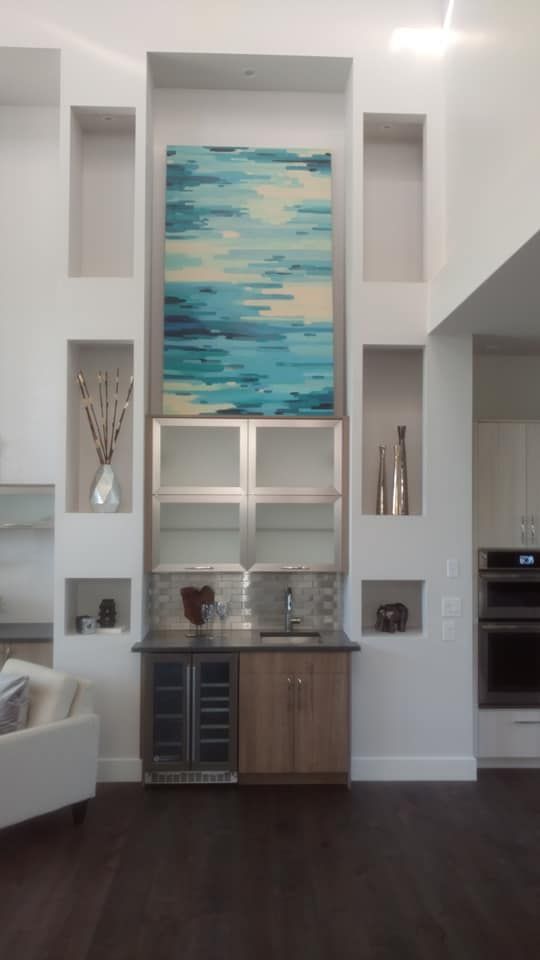 A Large Blue And White Painting Hangs Above A Kitchen | Littleton, CO | All Phase Construction Company LLC