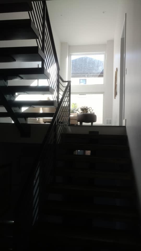 A Staircase Leading Up To The Second Floor Of A House | Littleton, CO | All Phase Construction Company LLC