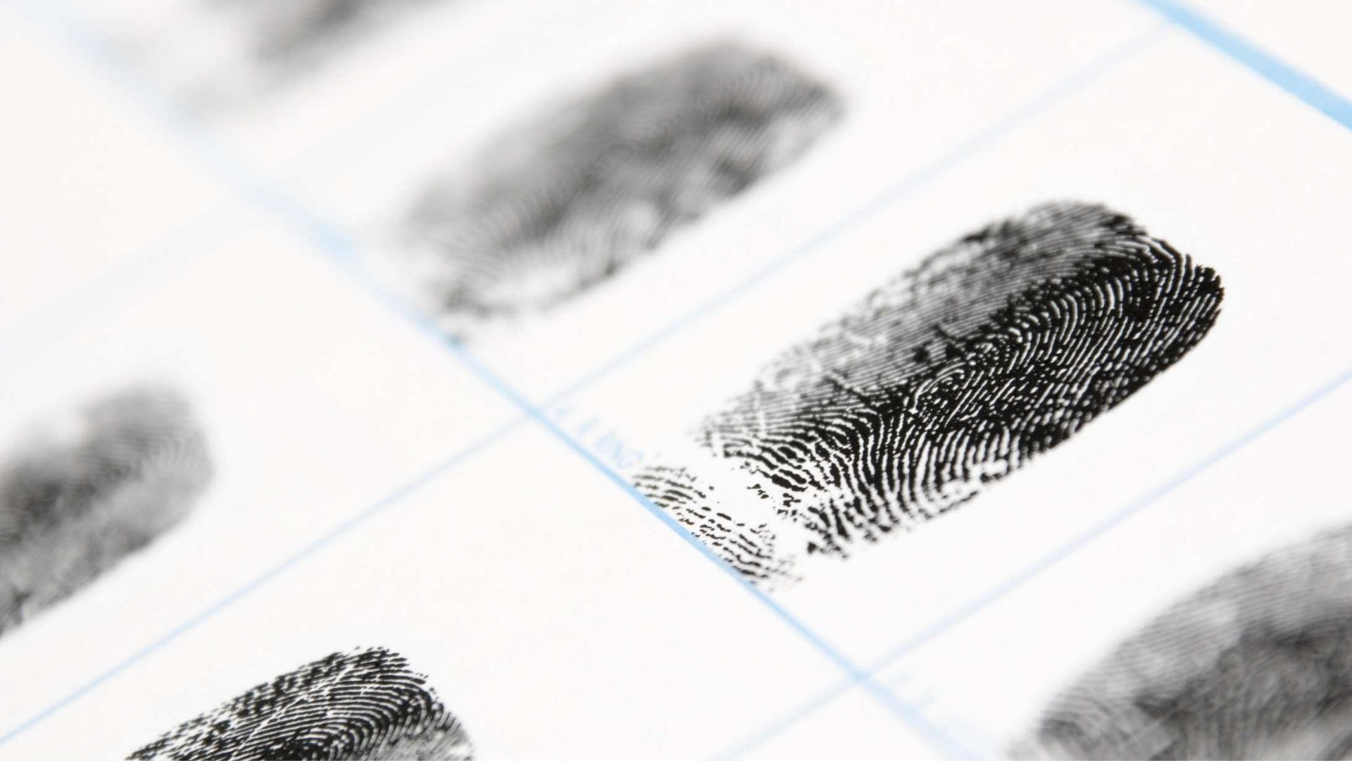 Fingerprints on a white form, used for identification or evidence collection.