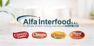 The logo for alfa interfood s.a.l. is on a table.