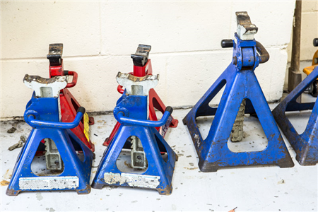 A row of blue and red jack stands sitting next to each other.