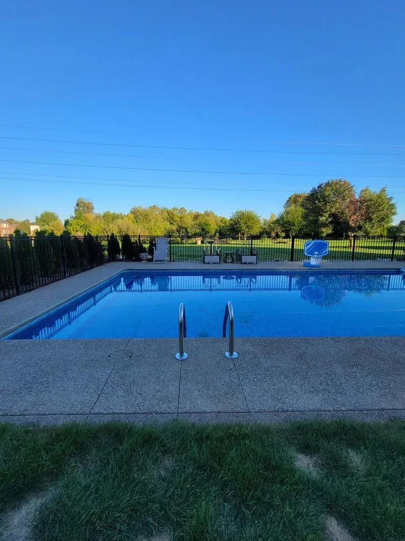 A metal fence installation in Troy, MI around a pool by Elite Wood Fencing