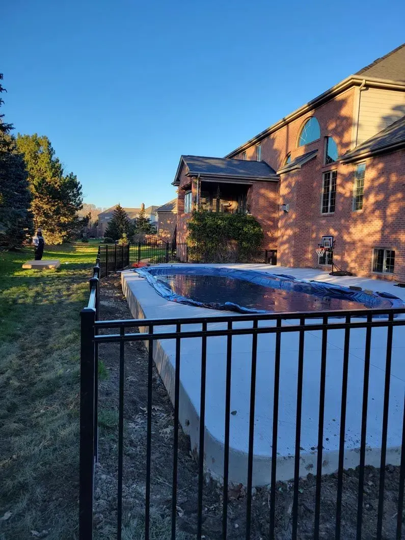 A metal fence installation in Troy, MI by Elite Wood Fencing