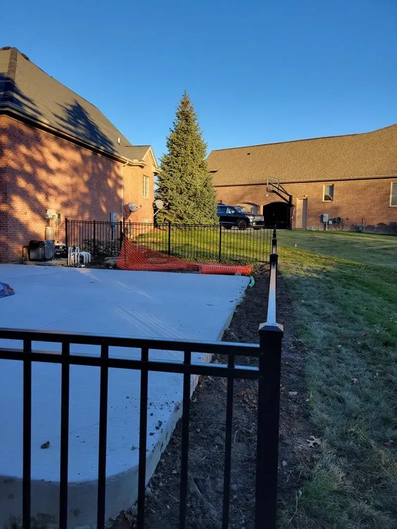 A metal fence installation in Troy, MI by Elite Wood Fencing