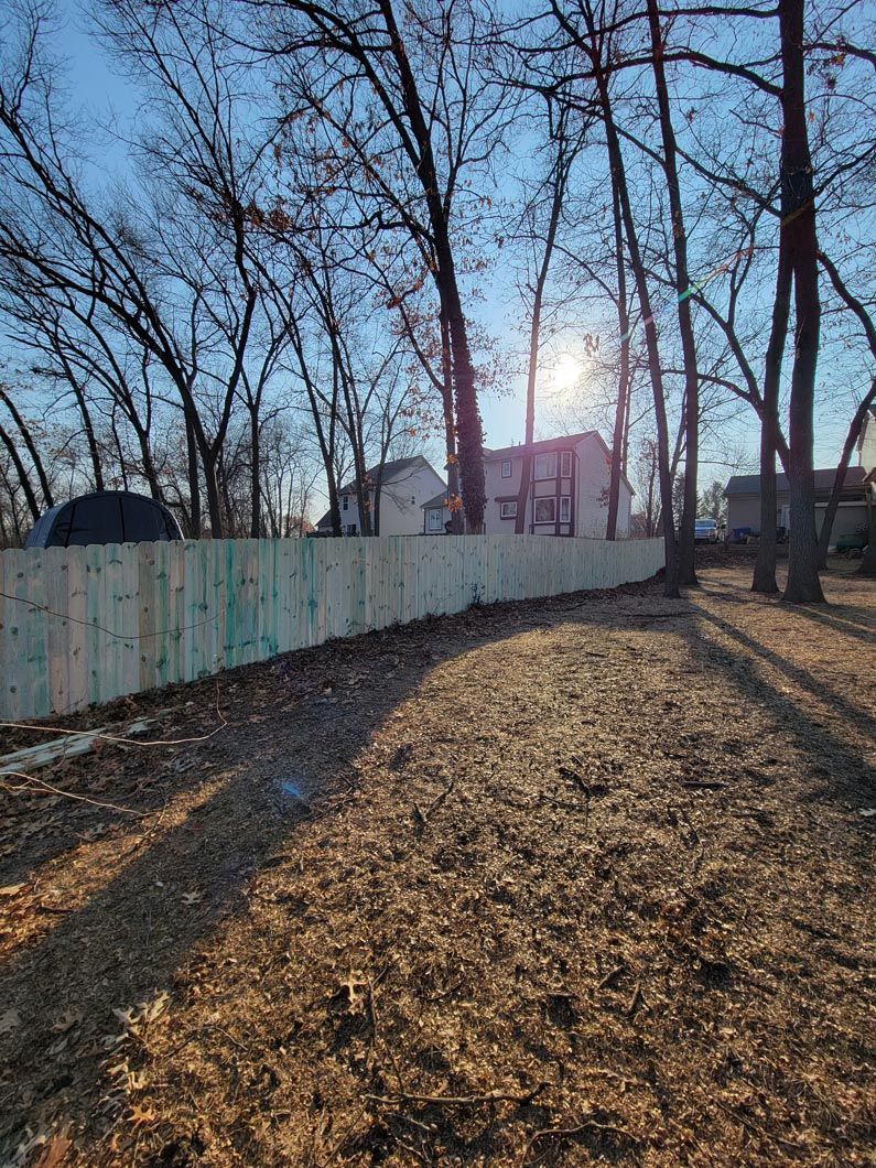 A wood privacy wall in Troy, MI in a backyard in by Elite Wood Fencing