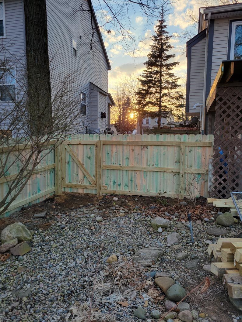 A wood privacy wall in Troy, MI in a backyard in by Elite Wood Fencing