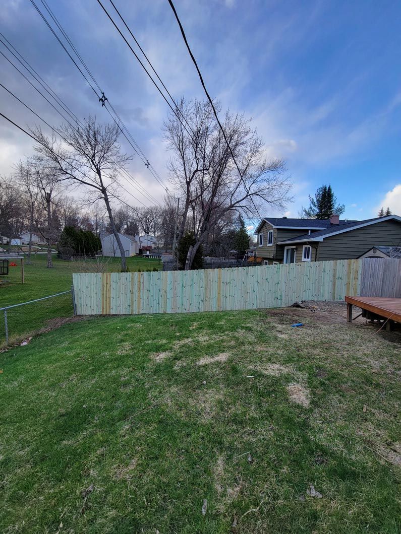 A wood privacy wall in Troy, MI in a backyard in by Elite Wood Fencing
