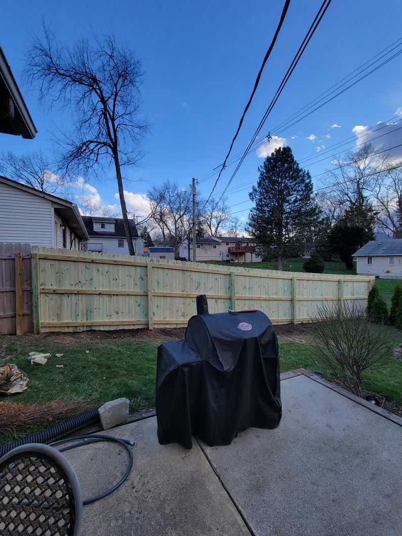 A wood privacy wall in Troy, MI in a backyard in by Elite Wood Fencing