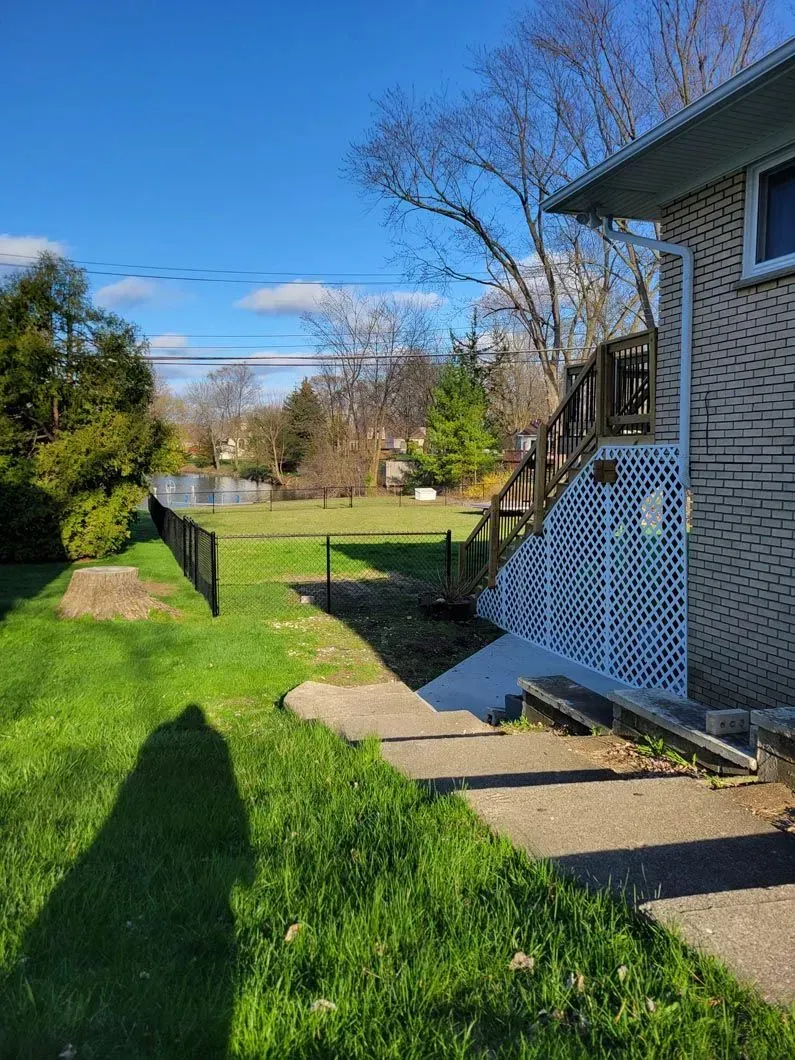 A metal fence installation in Troy, MI by Elite Wood Fencing