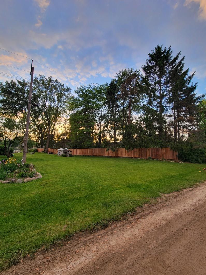 A wood privacy wall in Troy, MI in a backyard in by Elite Wood Fencing