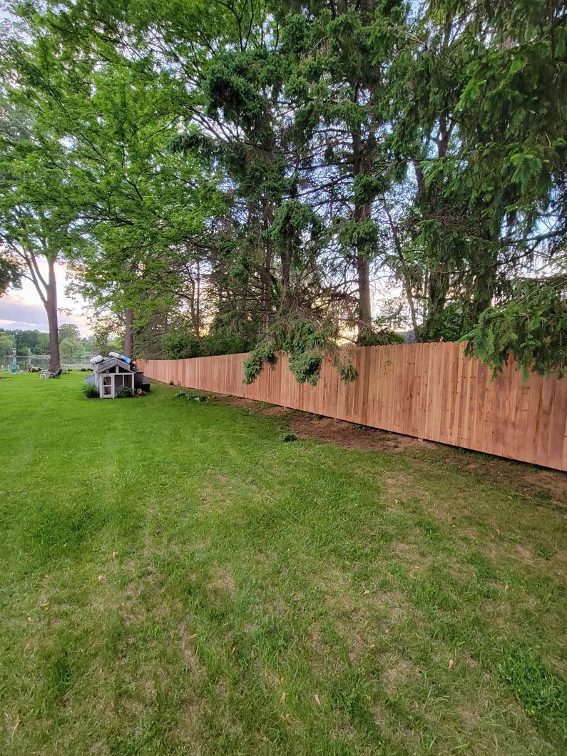A wood privacy wall in Troy, MI in a backyard in by Elite Wood Fencing
