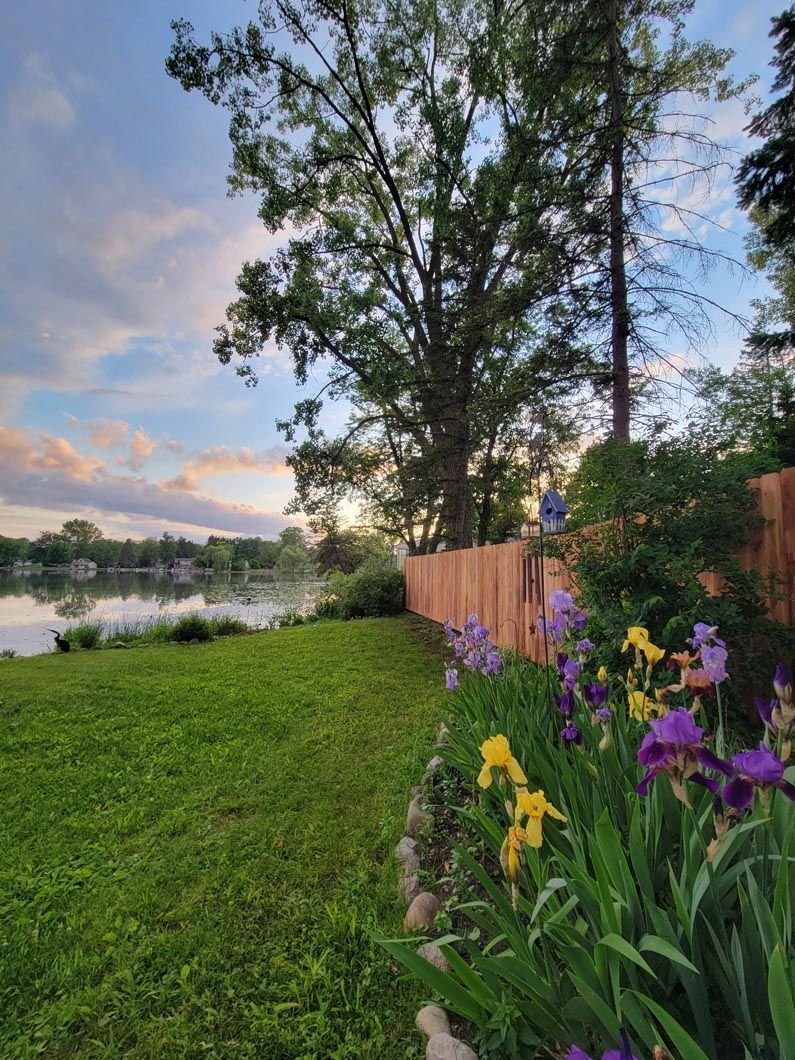 A wood privacy wall in Troy, MI in a backyard in by Elite Wood Fencing