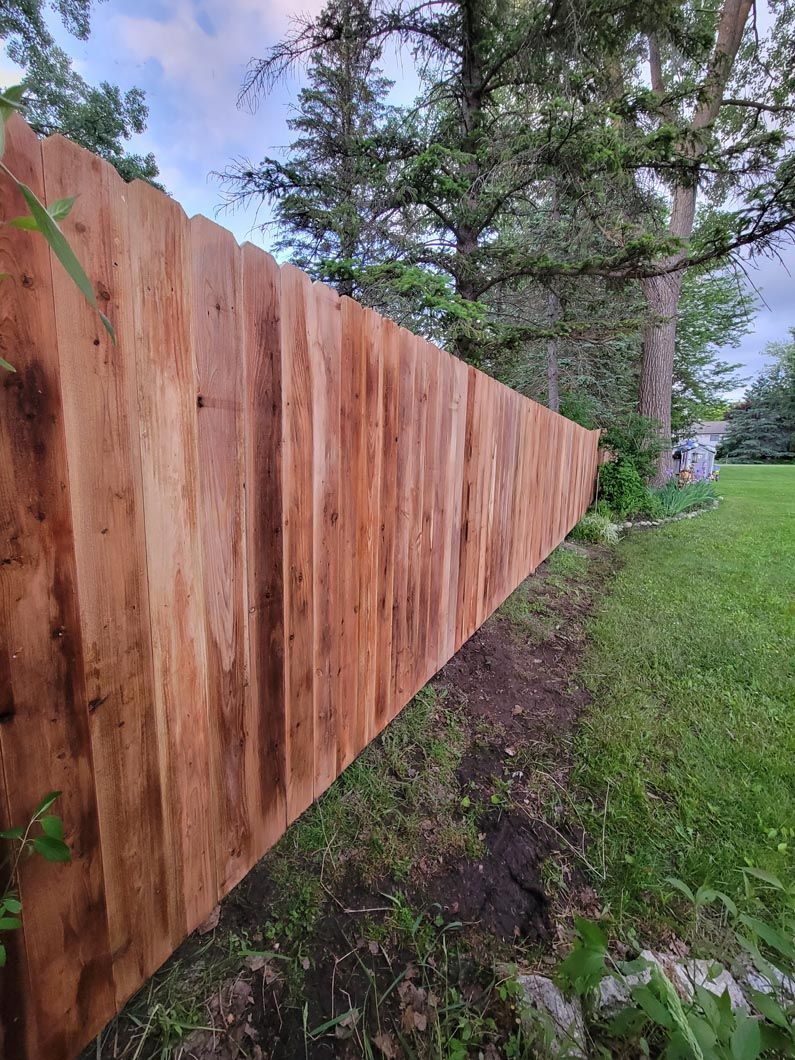 A wood privacy wall in Troy, MI in a backyard in by Elite Wood Fencing