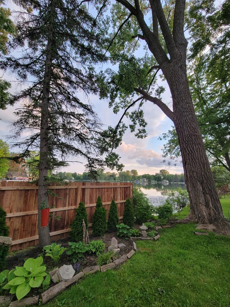 A wood privacy wall in Troy, MI in a backyard in by Elite Wood Fencing