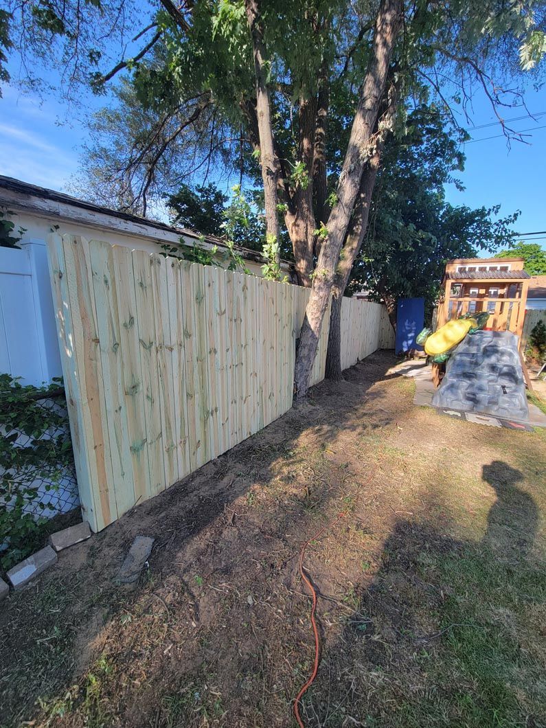 A wood privacy wall in Troy, MI in a backyard in by Elite Wood Fencing