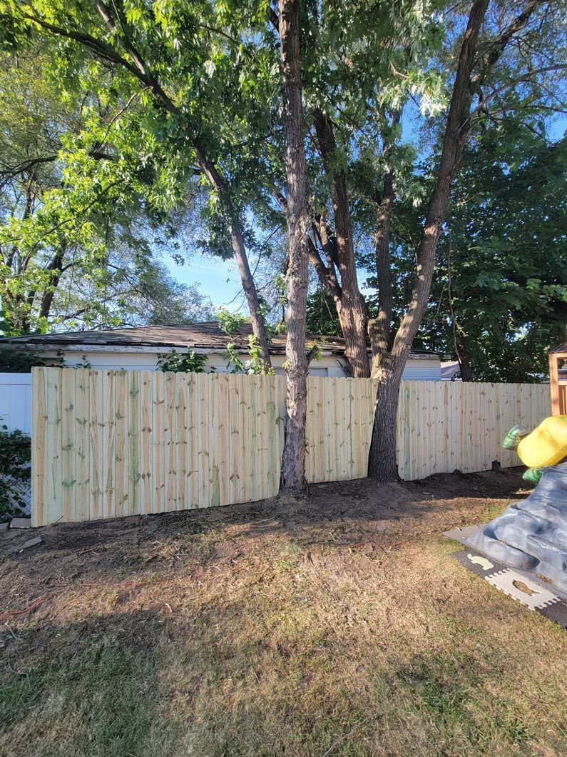 A wood privacy wall in Troy, MI in a backyard in by Elite Wood Fencing