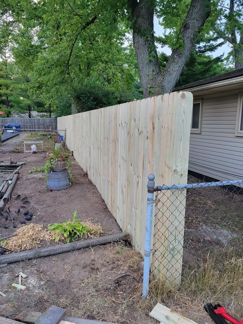 A wood privacy wall in Troy, MI in a backyard in by Elite Wood Fencing