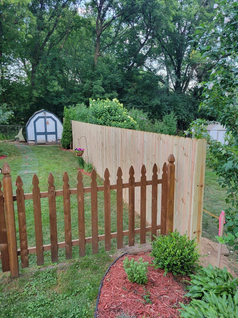 A wood privacy wall in Troy, MI in a backyard in by Elite Wood Fencing