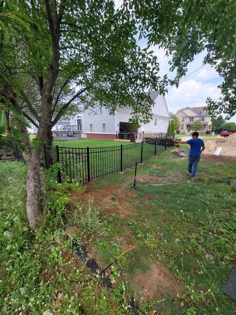 A metal fence installation in Troy, MI by Elite Wood Fencing