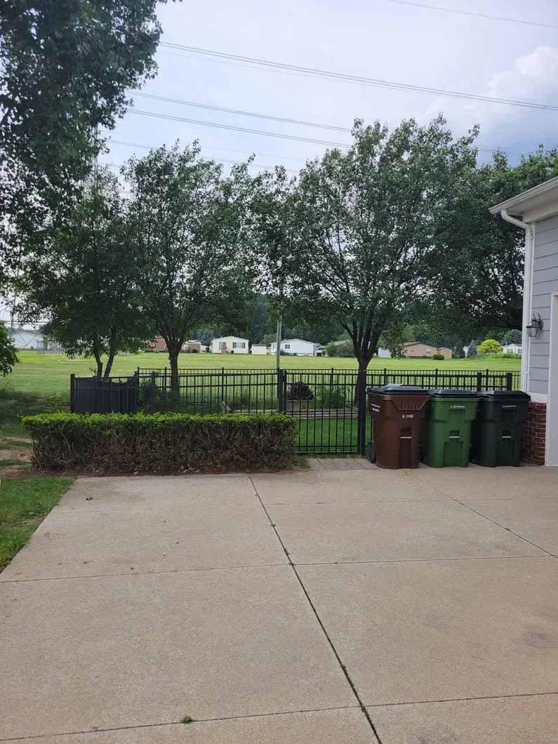 A metal fence installation in Troy, MI by Elite Wood Fencing