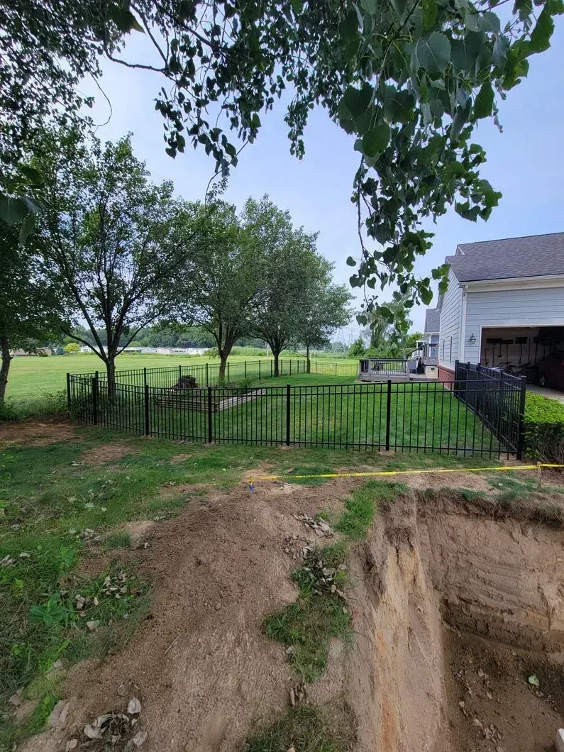A metal fence installation in Troy, MI by Elite Wood Fencing