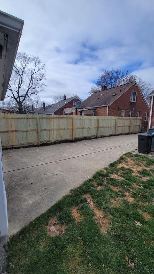 A metal fence installation in Troy, MI by Elite Wood Fencing