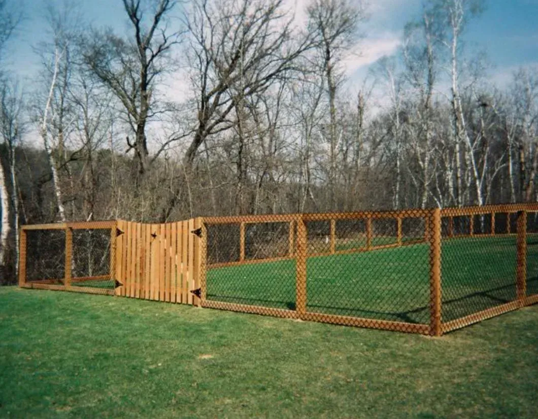 A wood gate with aluminum fencing in Troy, MI by Elite Wood Fencing