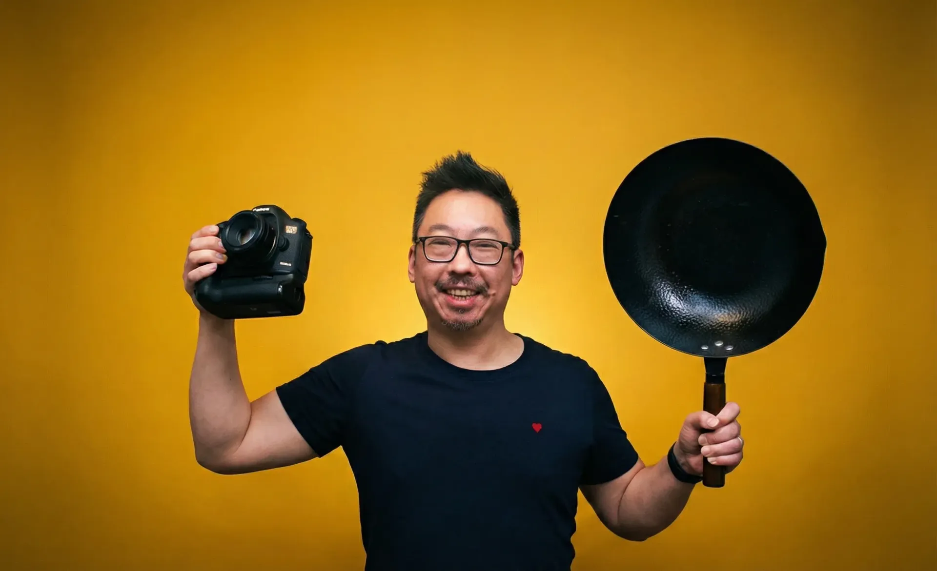 Two golden spring rolls on a white plate, garnished with mint, with a brown stripe design.