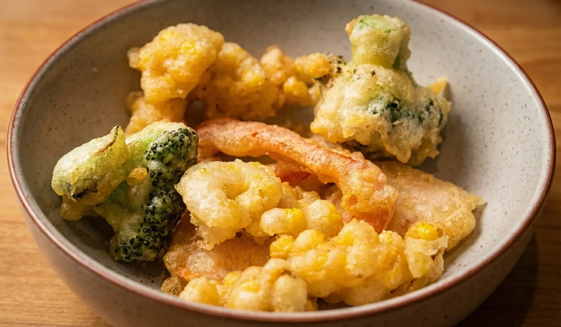 Bowl of assorted tempura vegetables and shrimp.