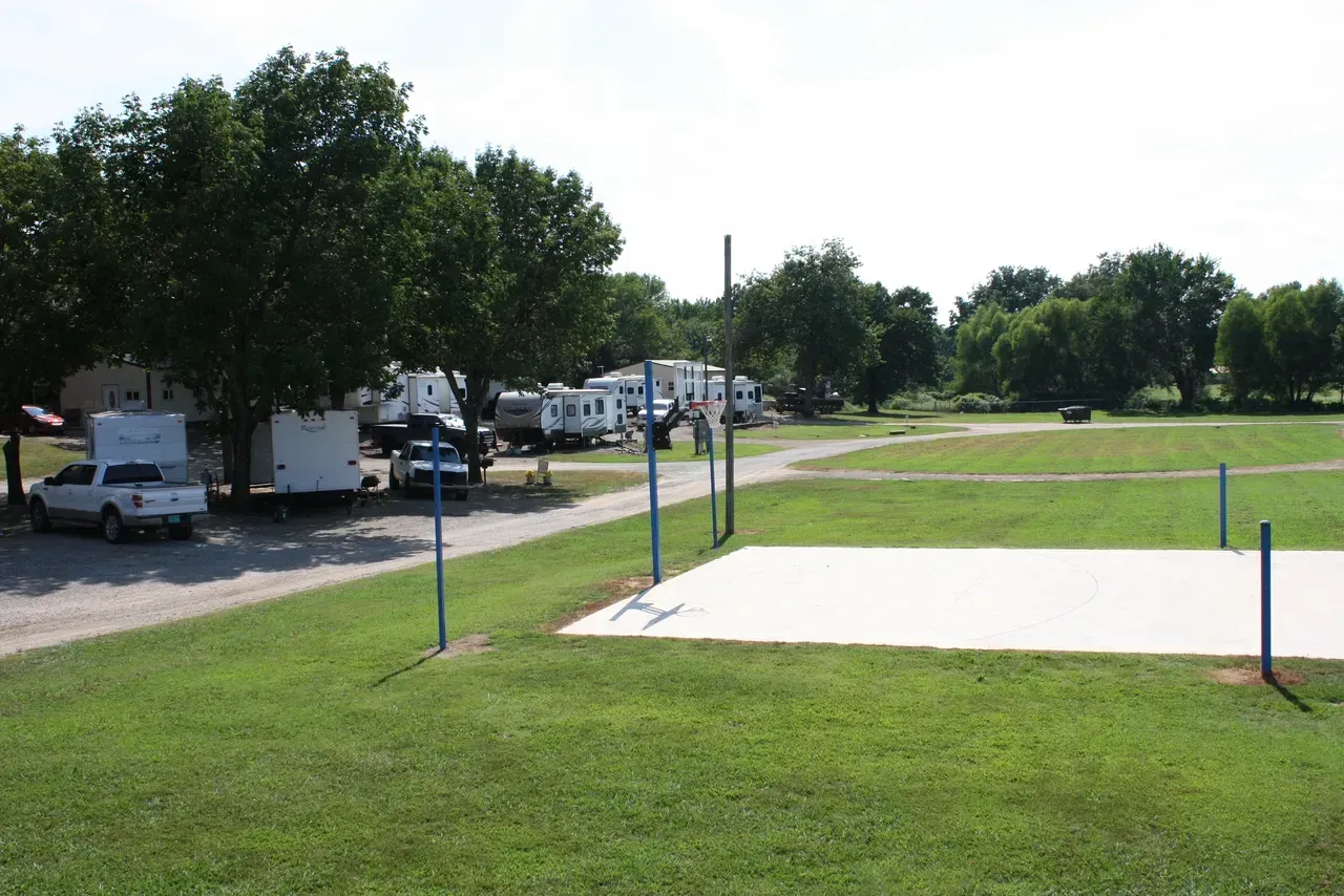 A volleyball court in the middle of a grassy field