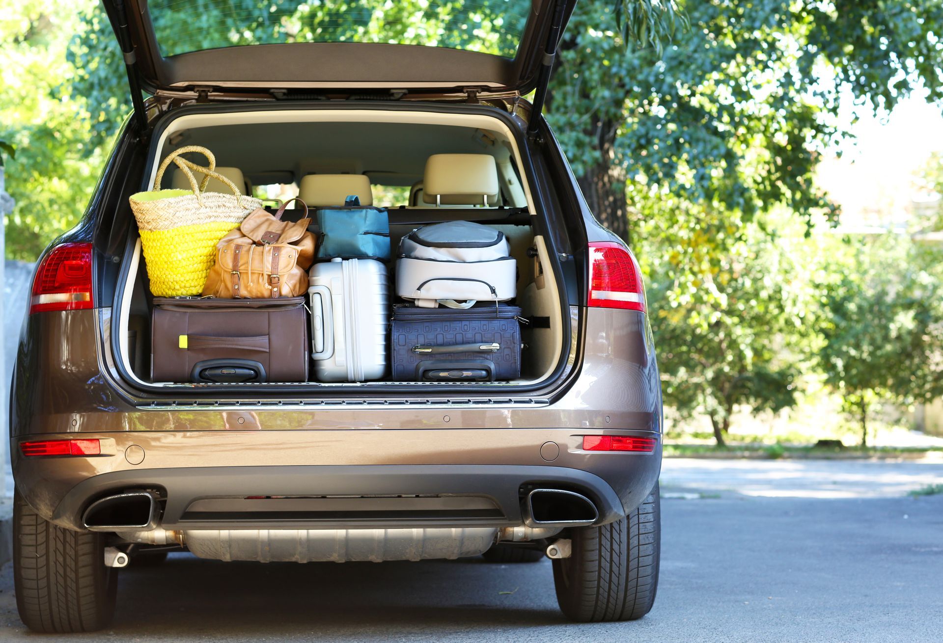 SUV trunk packed with luggage for travel.