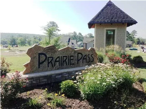 A sign that says prairie pass on it