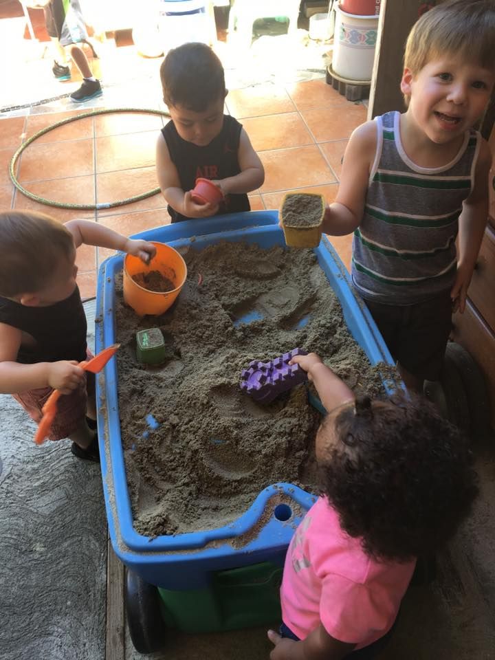 Vicky's Day Care with children playing sand.