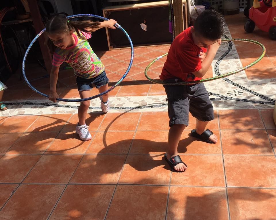 Vicky's Day Care with children playing hoops.