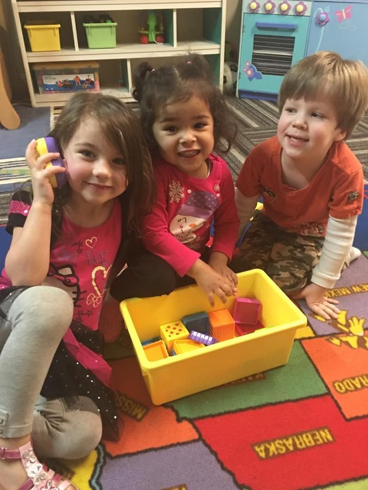 Vicky's Day Care with happy children playing.