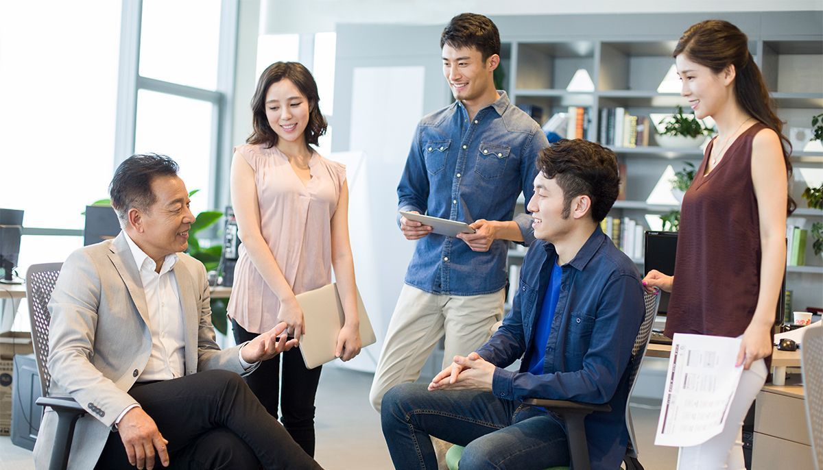 A group of people are having a meeting in an office.