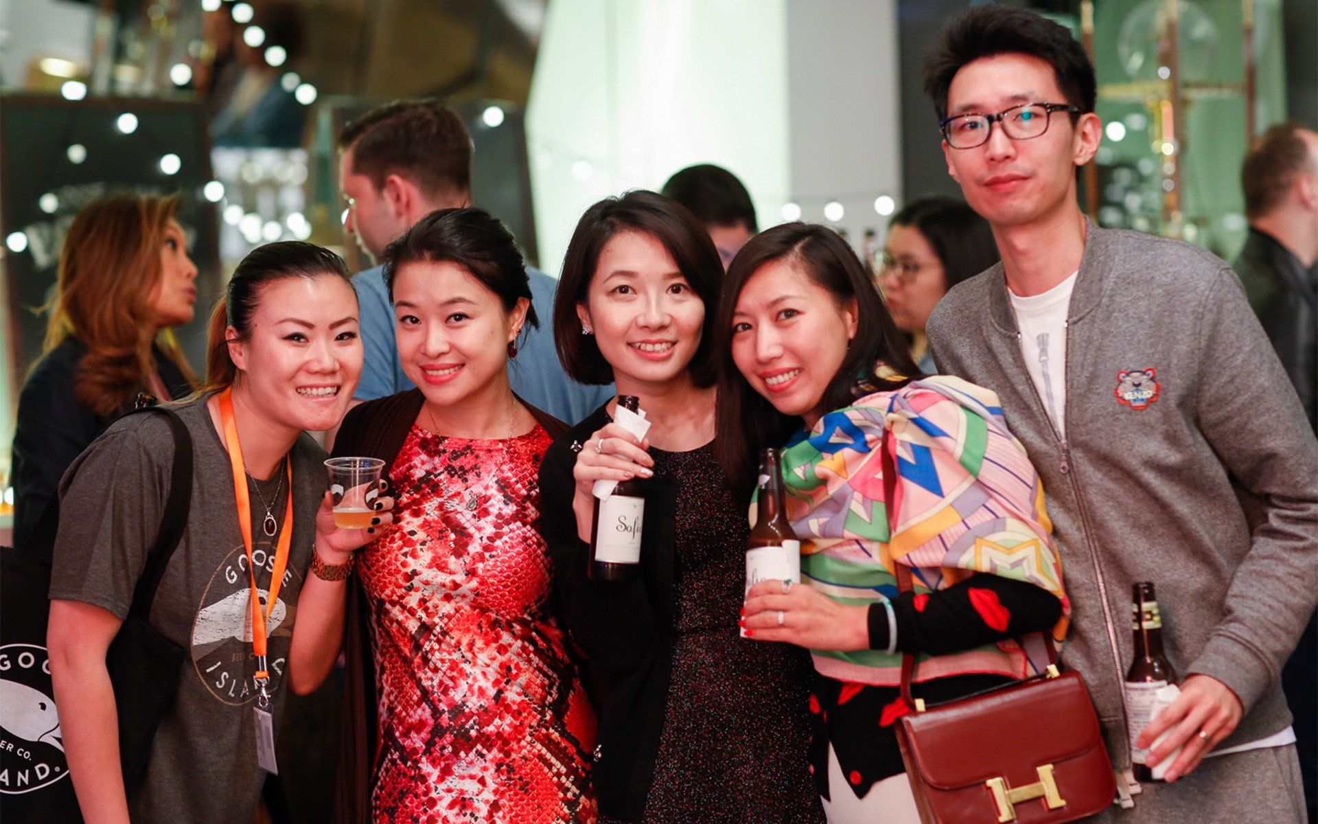 A group of people are posing for a picture at a party.