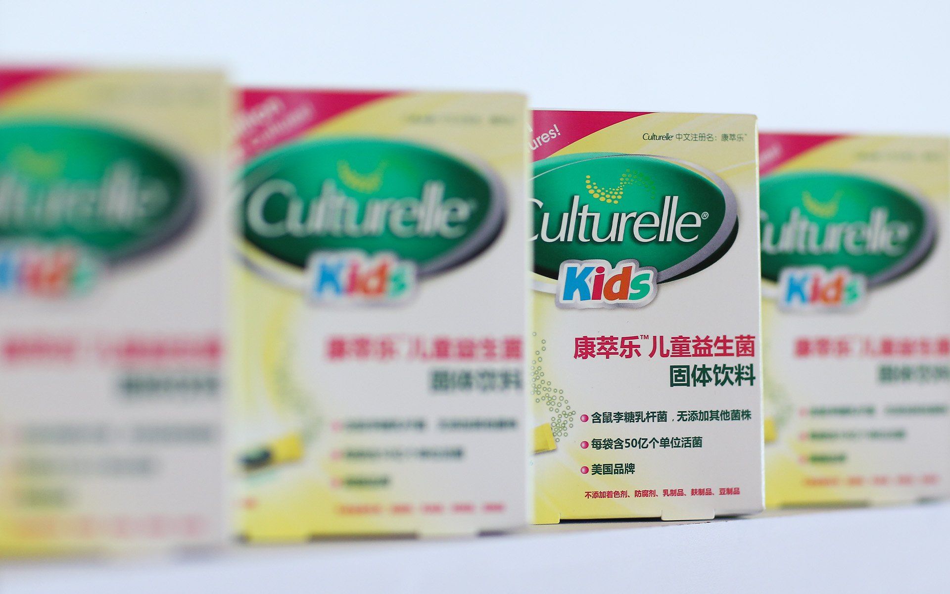 Several boxes of culturelle kids are lined up on a table