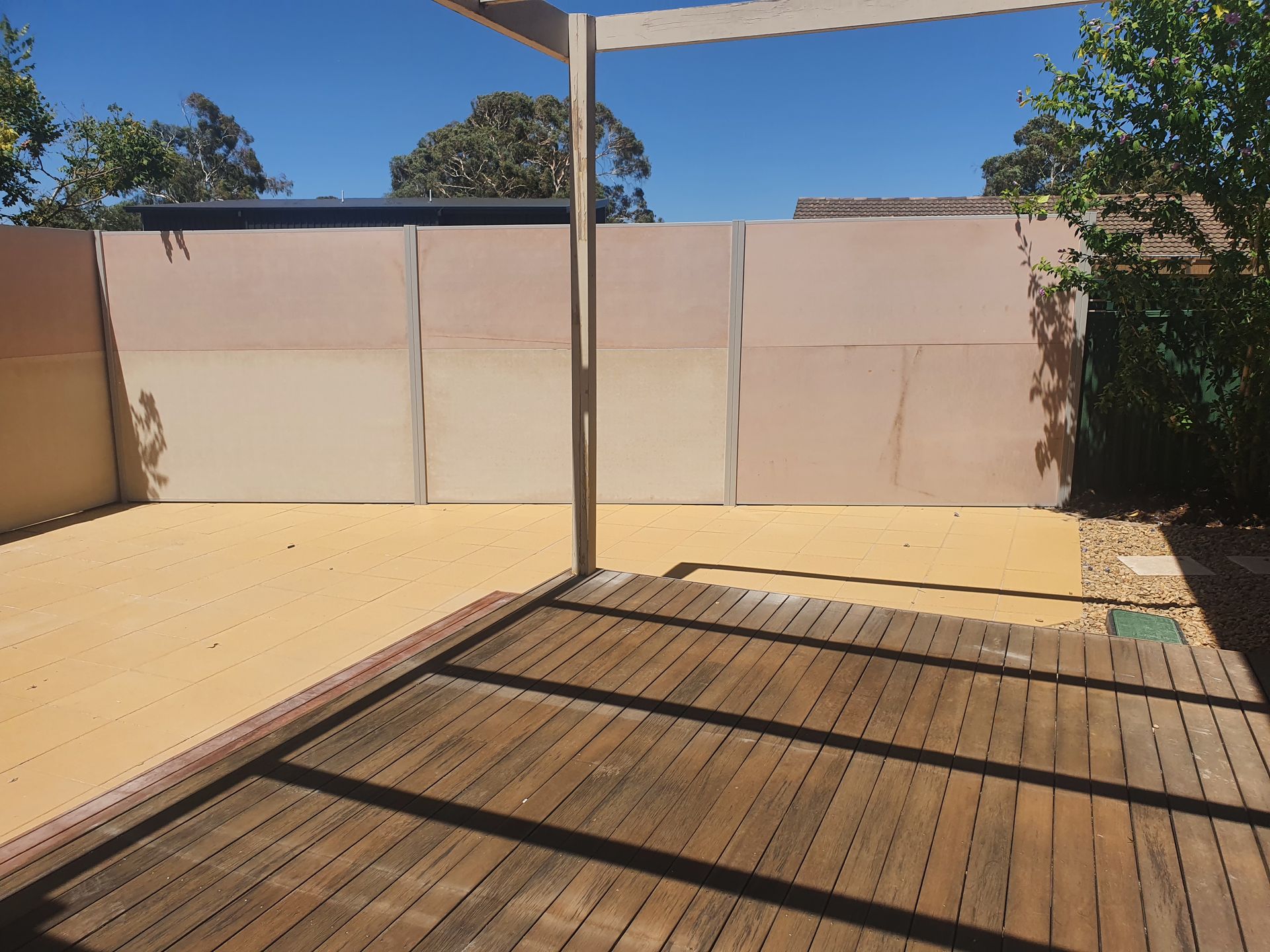 A Stone Wall Is Being Built in Front of A House — GnB Fencing and Excavation in Queanbeyan, NSW