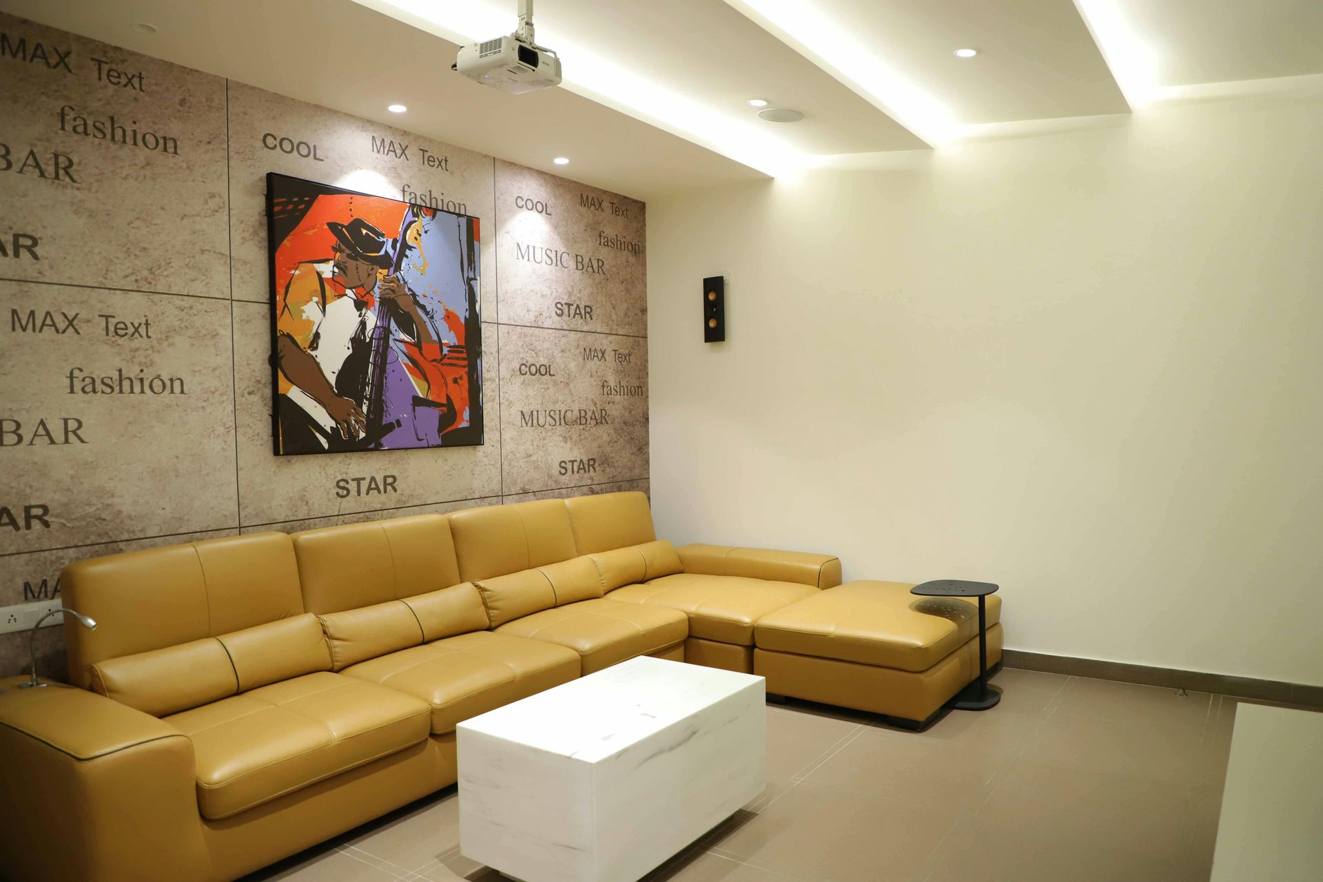 Modern living room with tan sectional sofa, abstract art, and white coffee table.