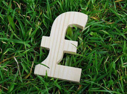 Pound sign of wood isolated on grass background