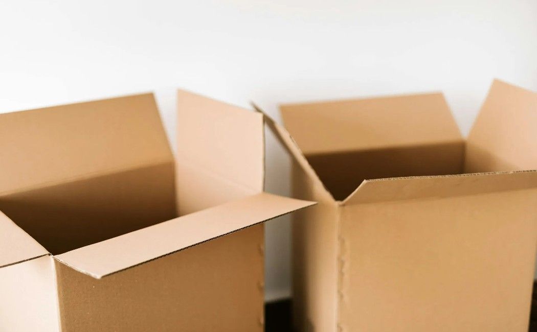 Several open brown cardboard boxes on a white background Several open brown cardboard boxes on a white background
