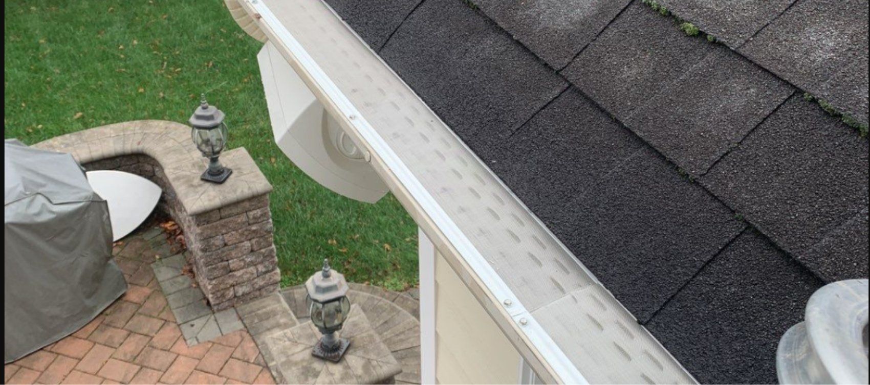 An aerial view of a gutter on the side of a house.