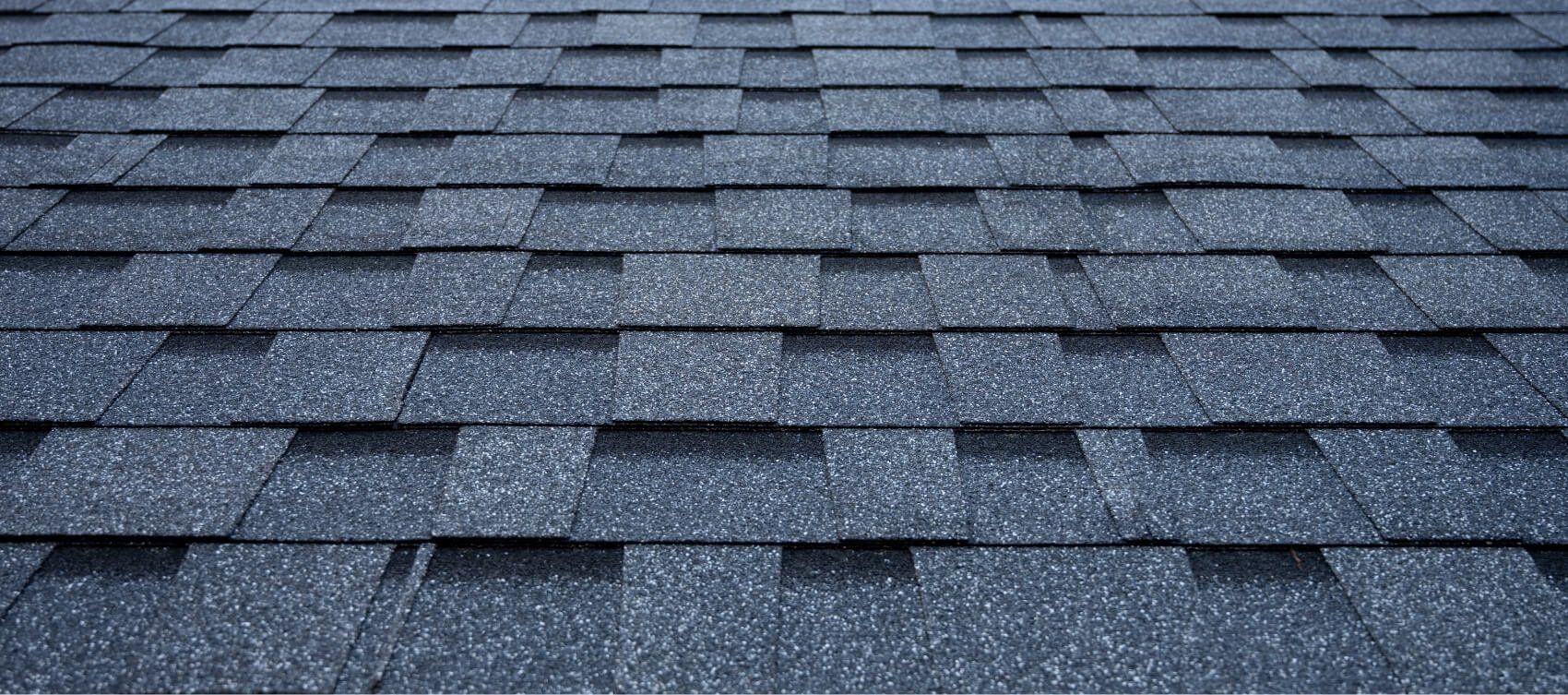 A close up of a roof with a lot of shingles on it.