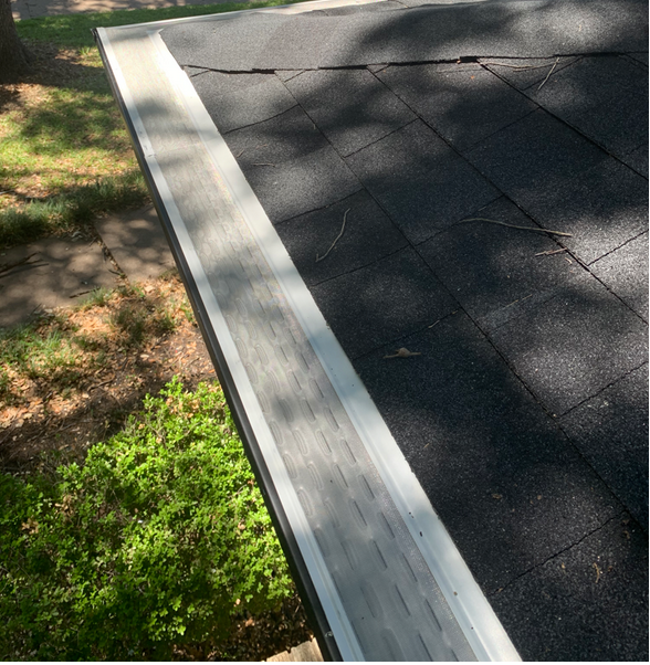 A close up of a gutter on a roof